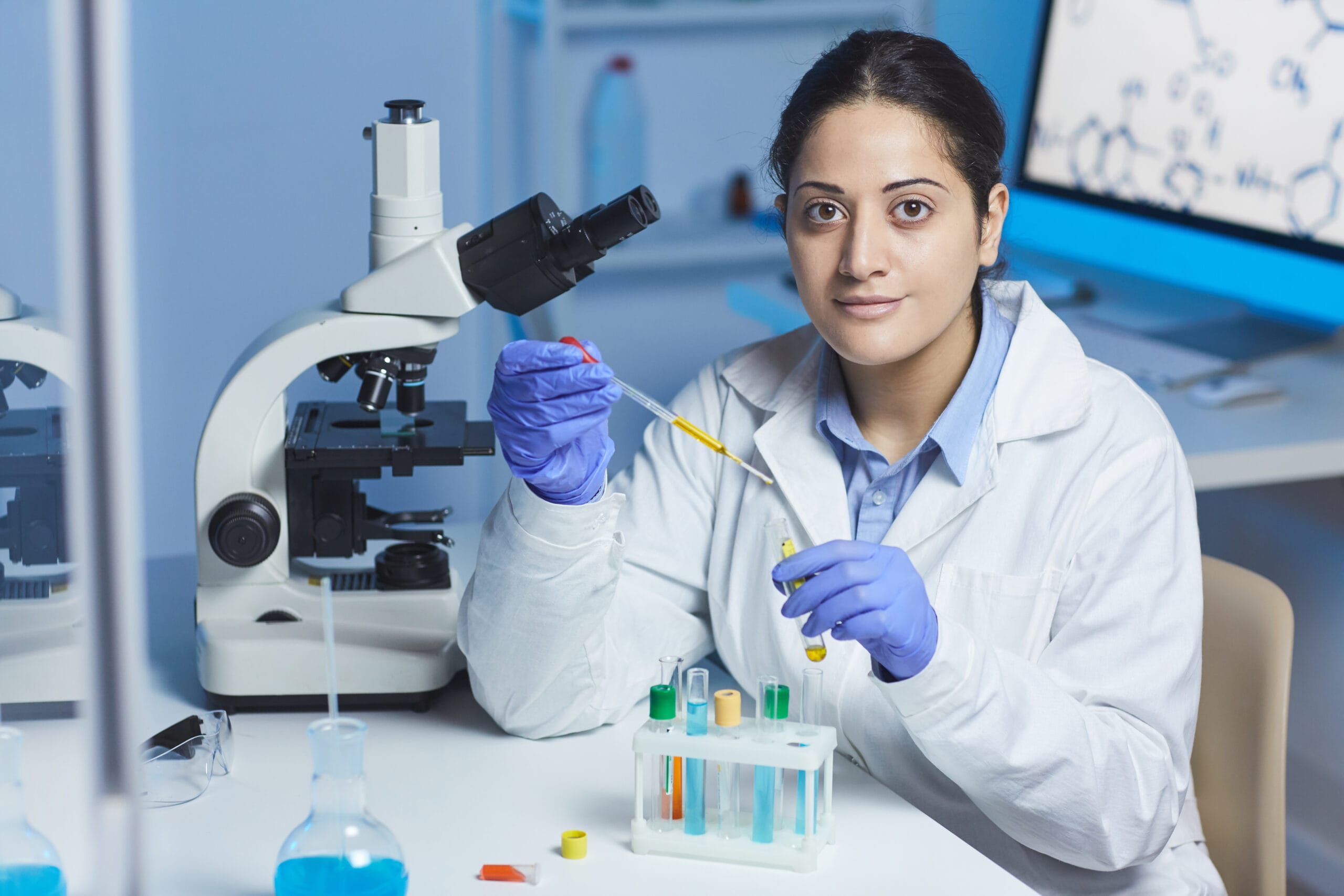indian pharmacist mixing reagents scaled